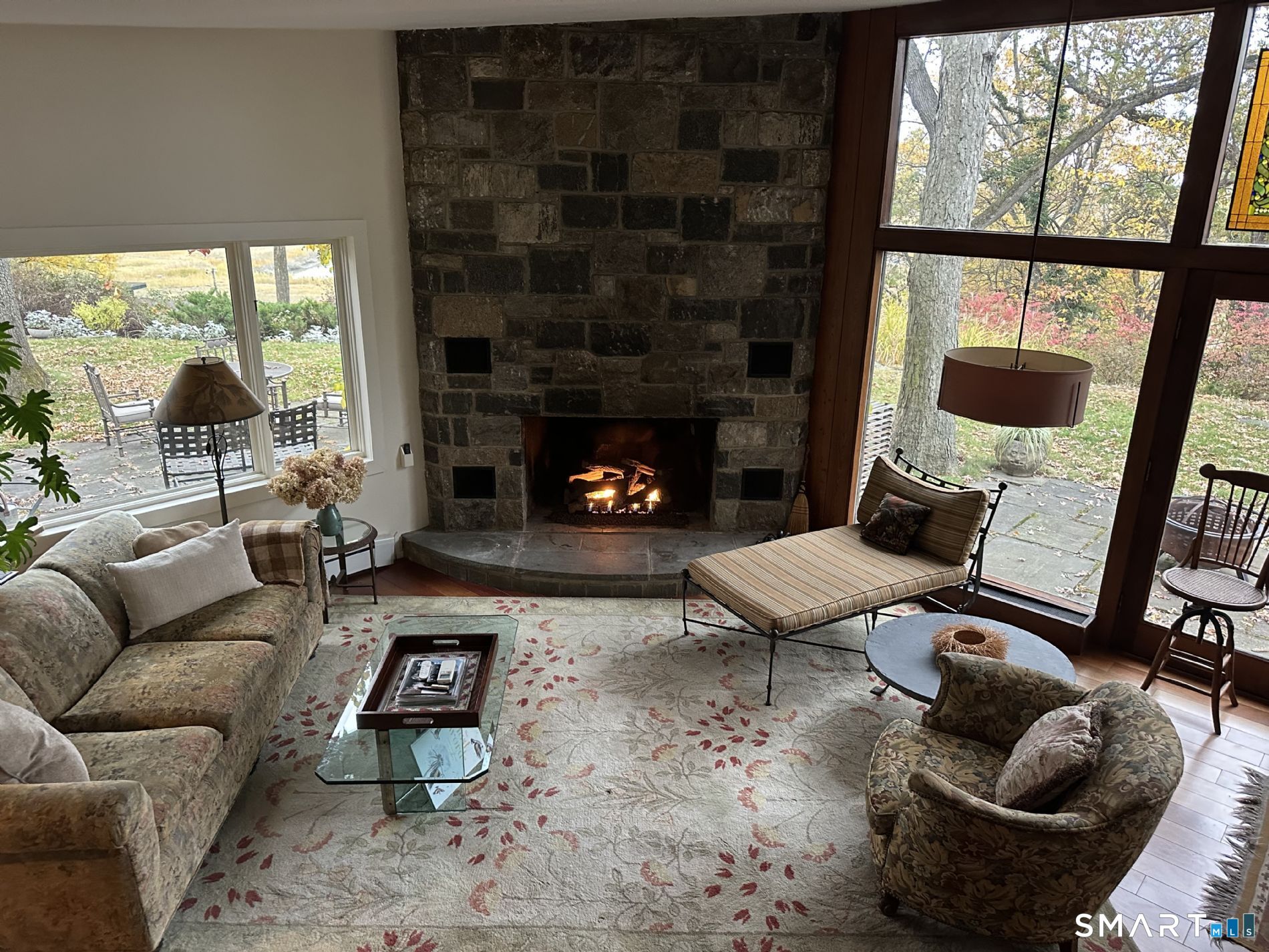 31 Splitrock Road Norwalk, CT 06854 - Photo 9 of 18 a living room with furniture and a fireplace