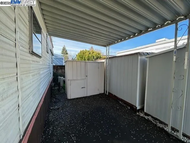a view of balcony with wooden floor
