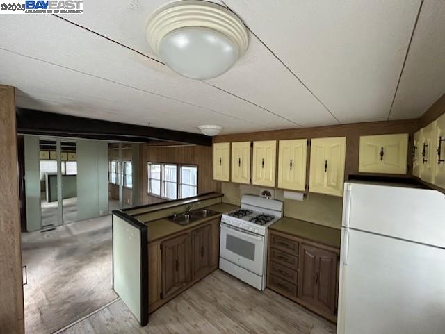 1382 Vía Deste, Unit 61 Livermore, CA 94551 - Photo 5 of 21 a kitchen with a stove a sink and a refrigerator