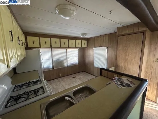 a living room with hard wood floor and a window