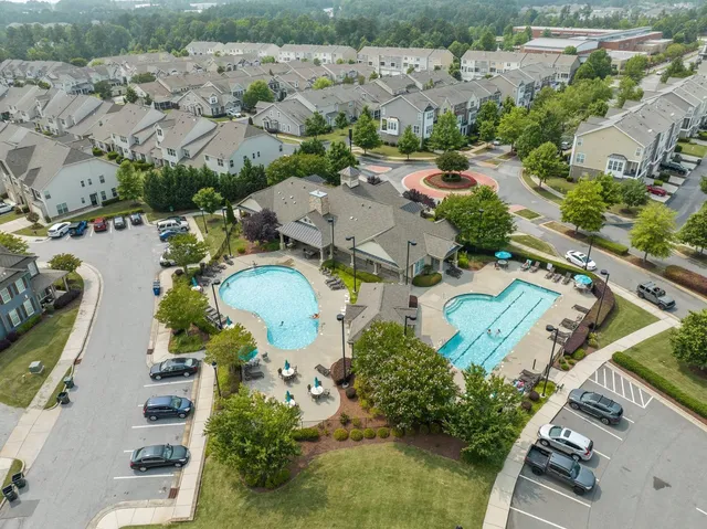an aerial view of residential houses with outdoor space