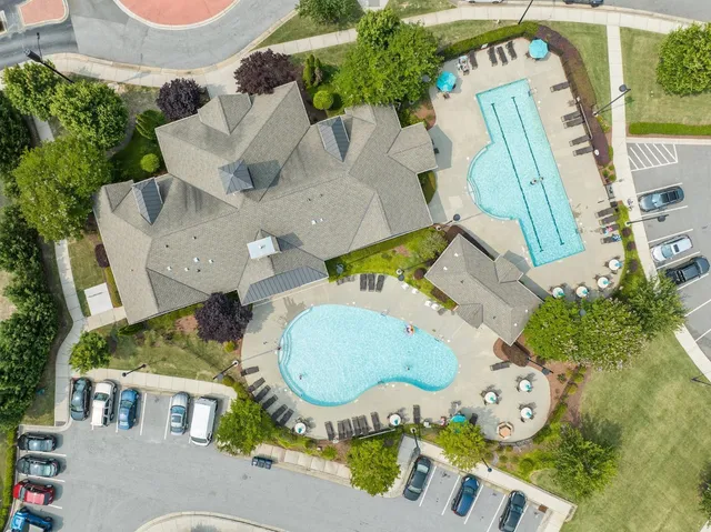 an aerial view of a house with a swimming pool