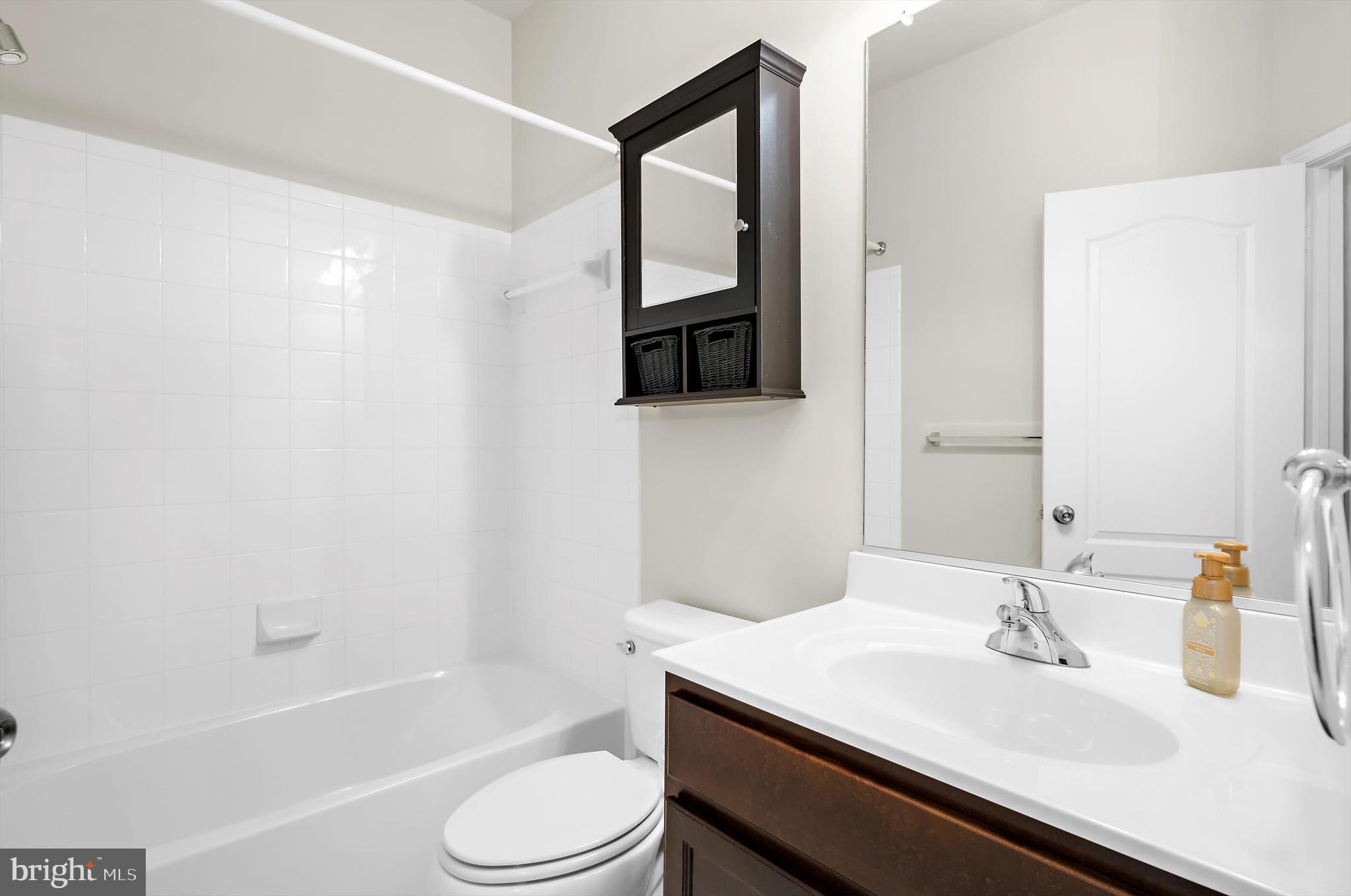 614 South Cherry Grove Avenue Annapolis, MD 21401 - Photo 18 of 40 a bathroom with a sink toilet and shower