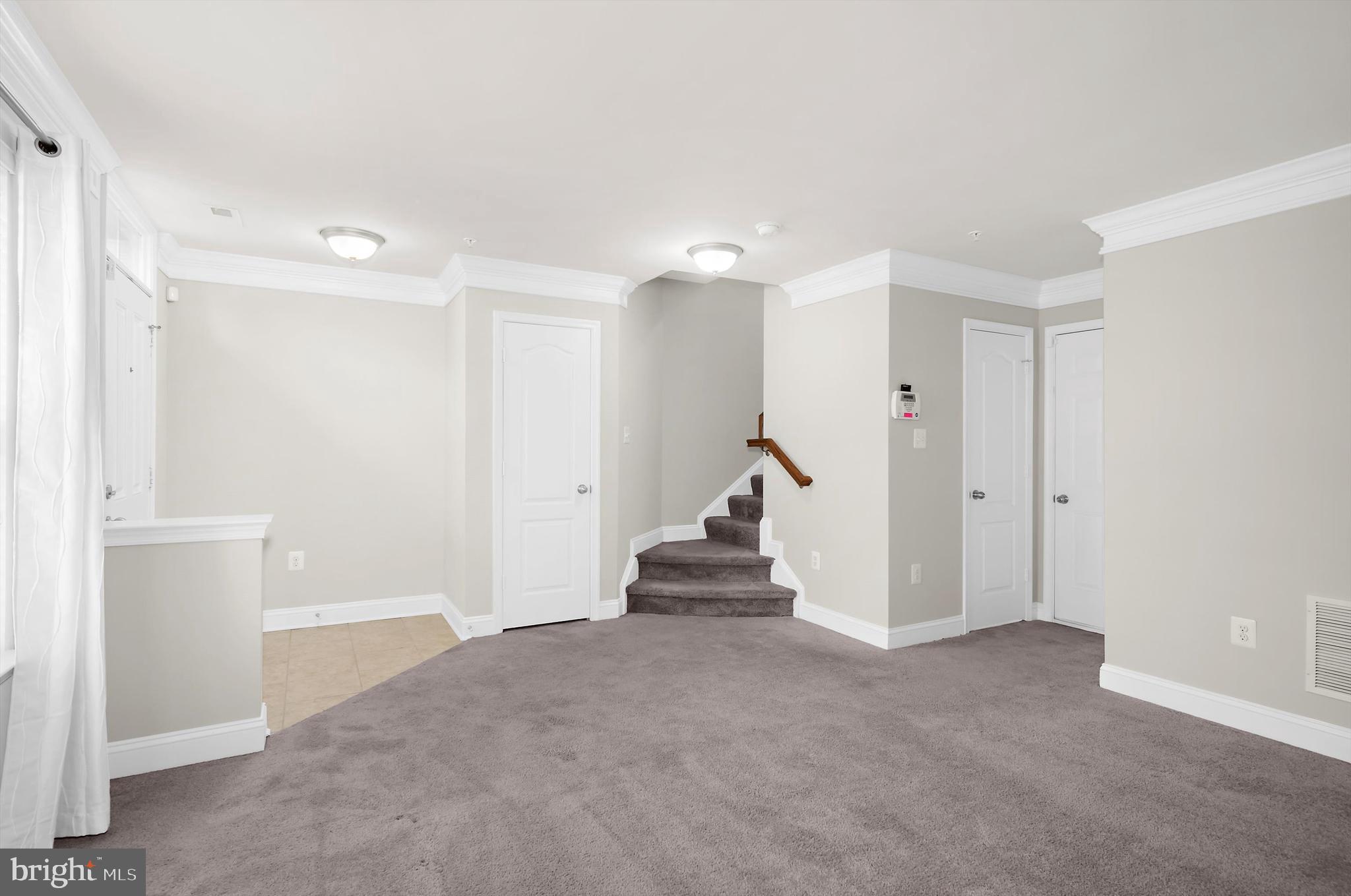 614 South Cherry Grove Avenue Annapolis, MD 21401 - Photo 4 of 40 a view of a hallway with a room and stairs