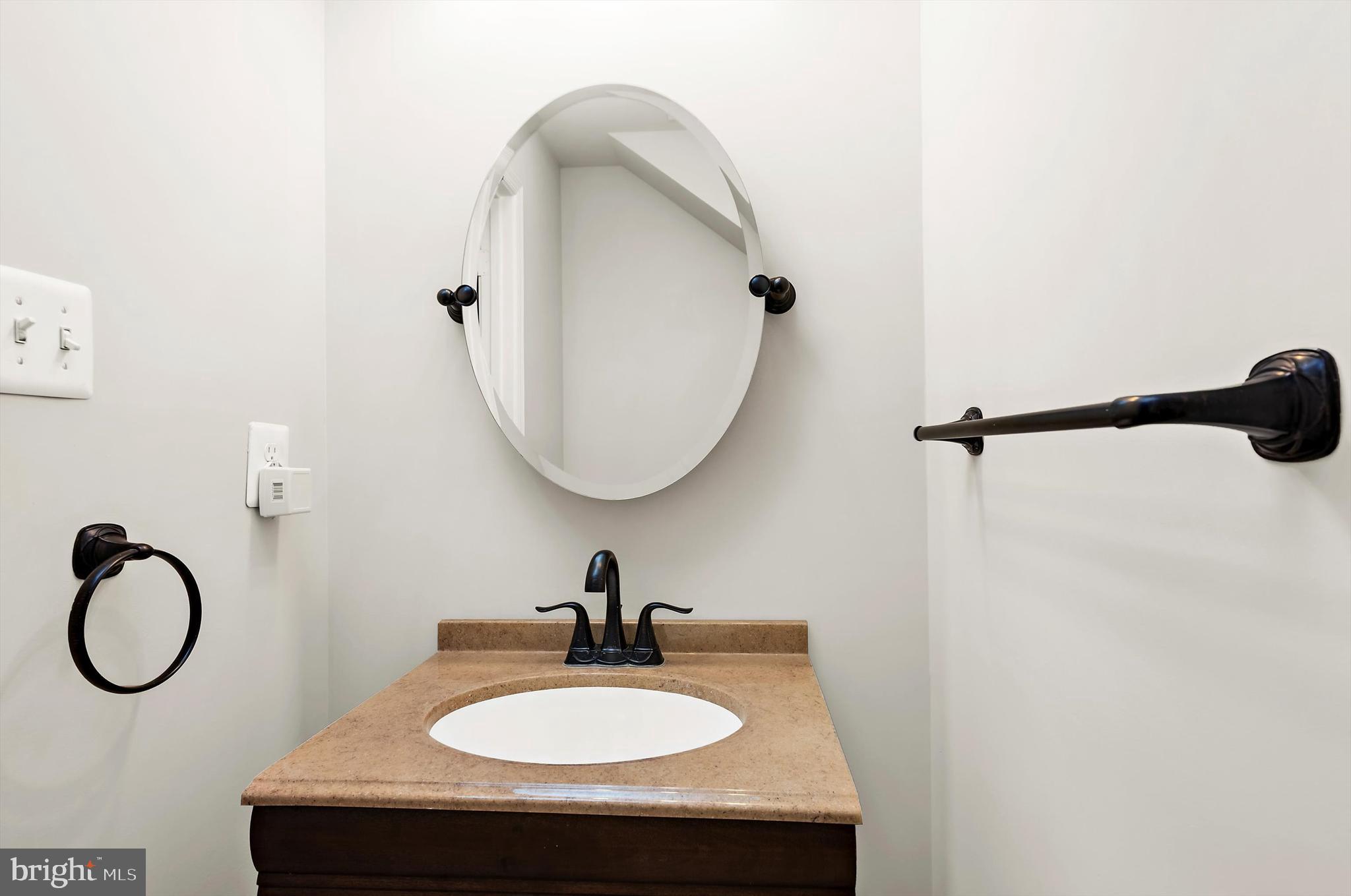 614 South Cherry Grove Avenue Annapolis, MD 21401 - Photo 5 of 40 a bathroom with a sink and a mirror