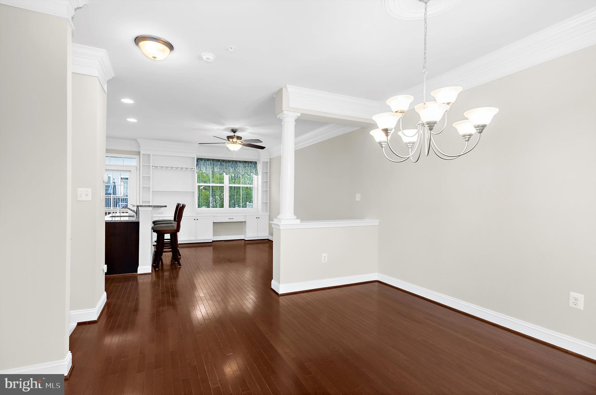 614 South Cherry Grove Avenue Annapolis, MD 21401 - Photo 8 of 40 a view of a room with wooden floor and kitchen