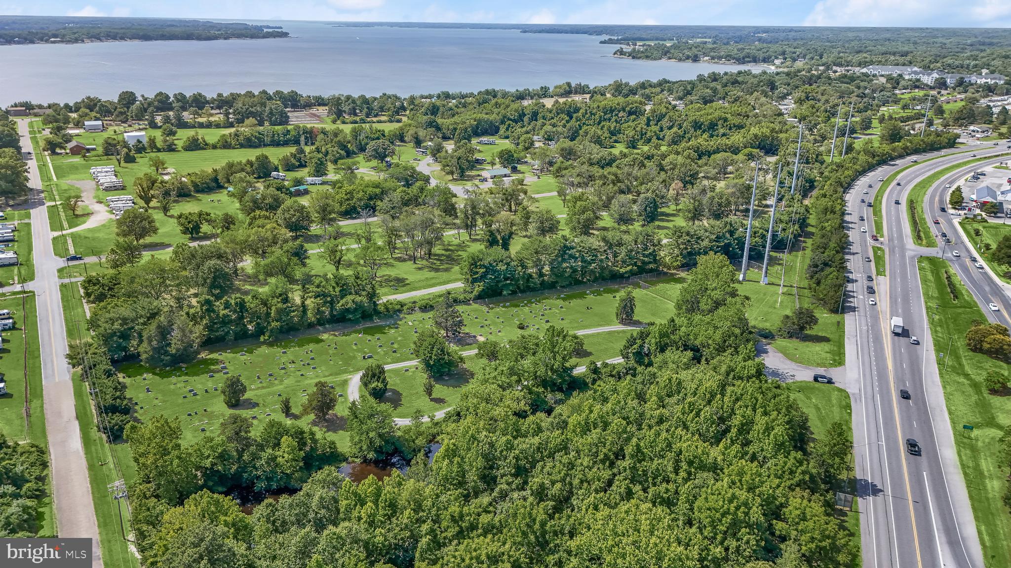 14055 Solomons Island Road South Solomons, MD 20688 - Photo 15 of 17 a view of a garden with a building in the background