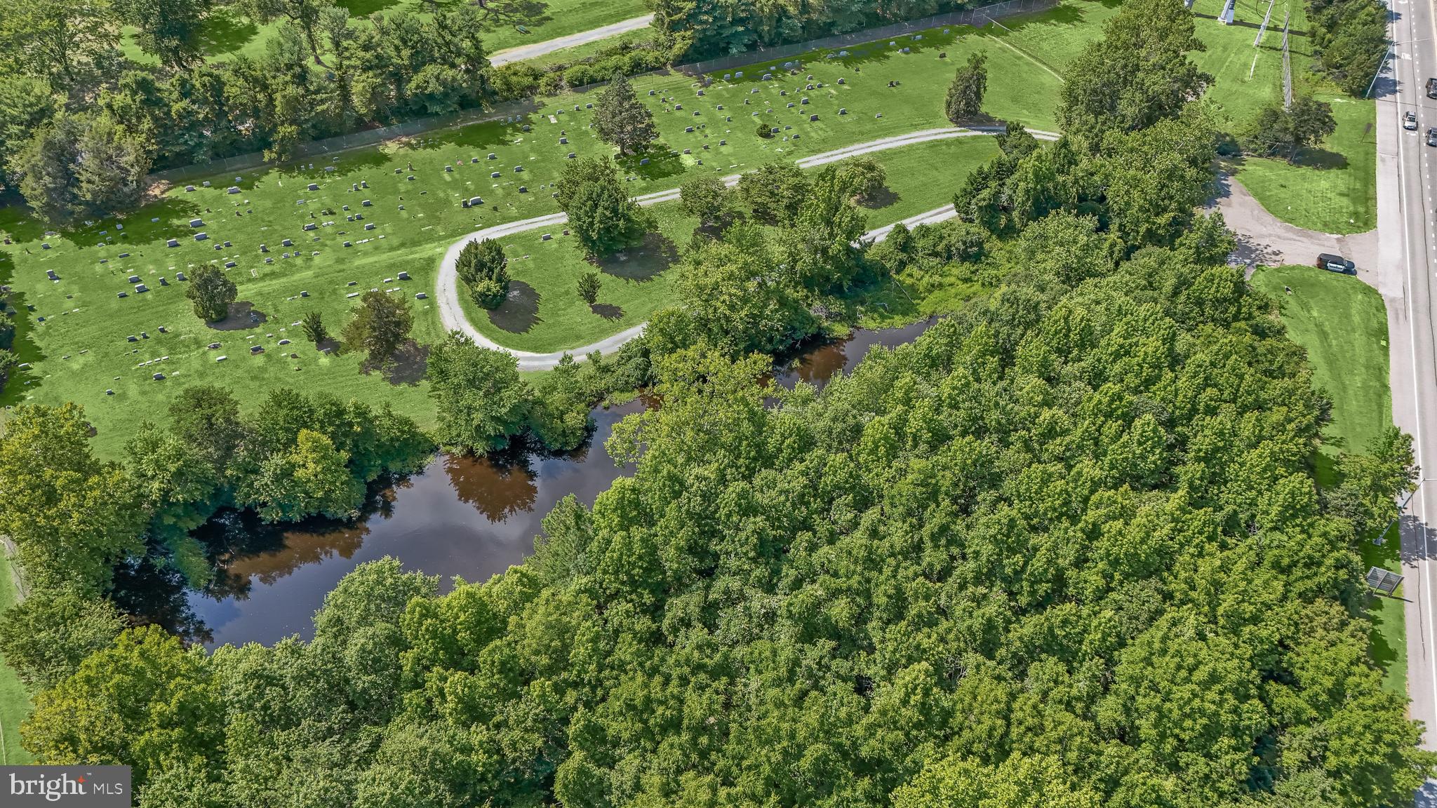 14055 Solomons Island Road South Solomons, MD 20688 - Photo 17 of 17 an aerial view of residential house with outdoor space and trees all around