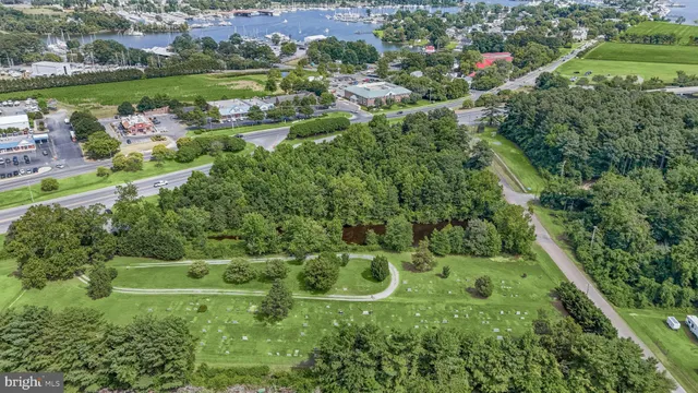 an aerial view of a houses with outdoor space and street view