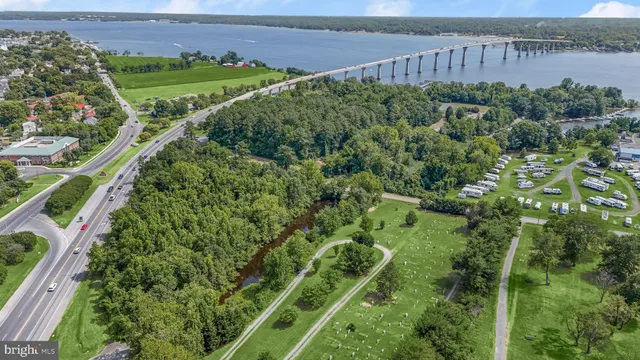 a view of a garden with a building in the background