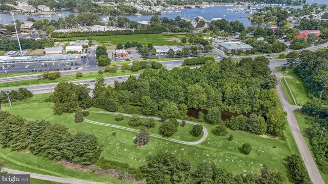 an aerial view of a houses with outdoor space and street view