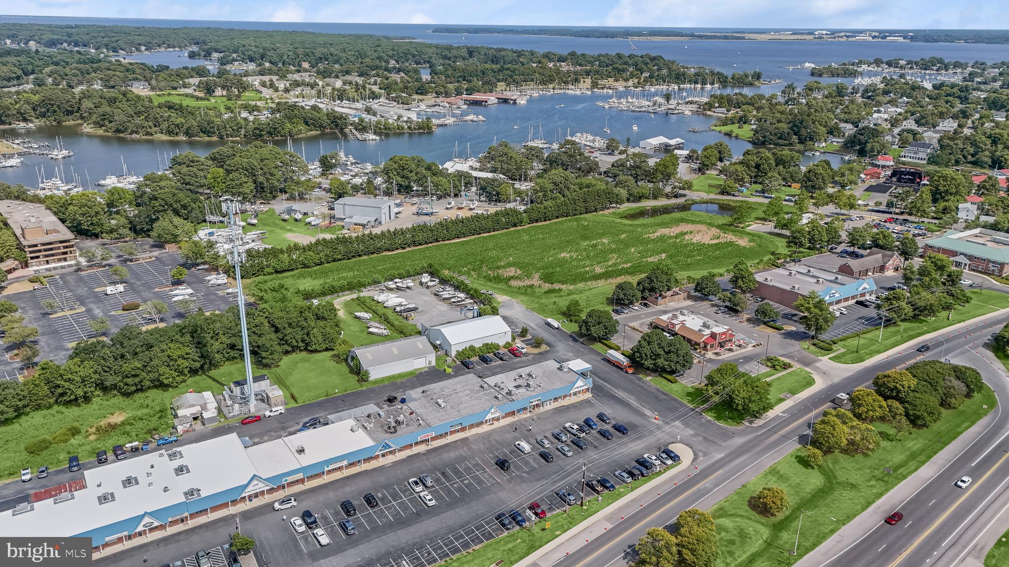 14055 Solomons Island Road South Solomons, MD 20688 - Photo 10 of 17 an aerial view of a city with a lake