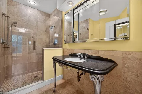 a bathroom with a sink and a mirror