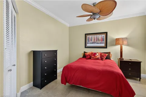 a bedroom with a bed and lamp