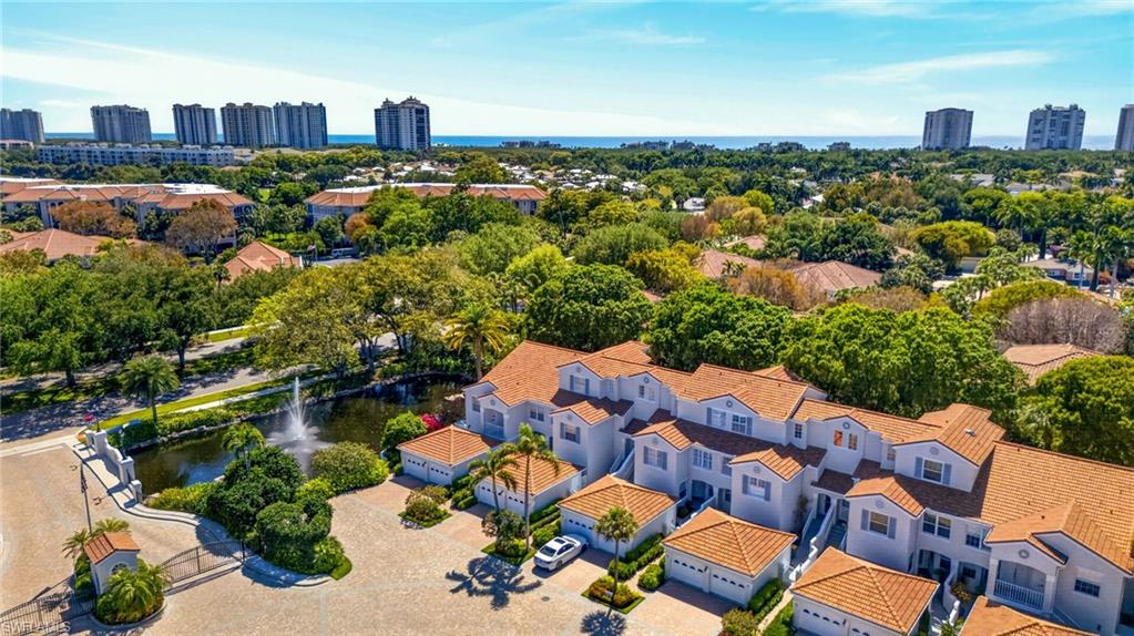 8420 Excalibur Circle, Unit R7 Naples, FL 34108 - Photo 23 of 24 Aerial view showcasing the property's location with distant ocean views