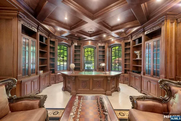 a living room with furniture a wooden floor and window with outer view