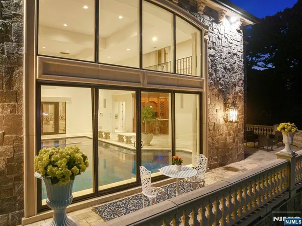 a room with furniture and large windows