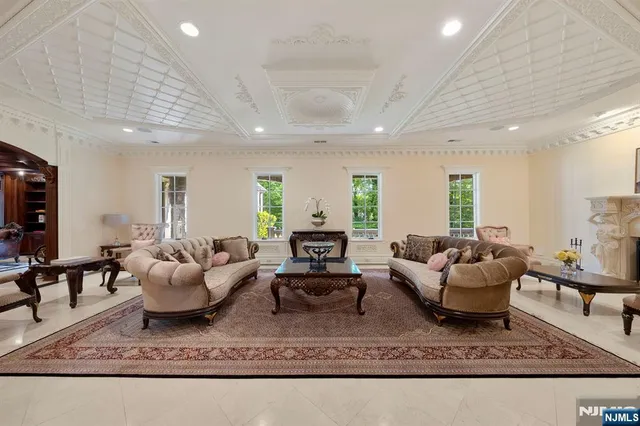 a living room with furniture and a rug
