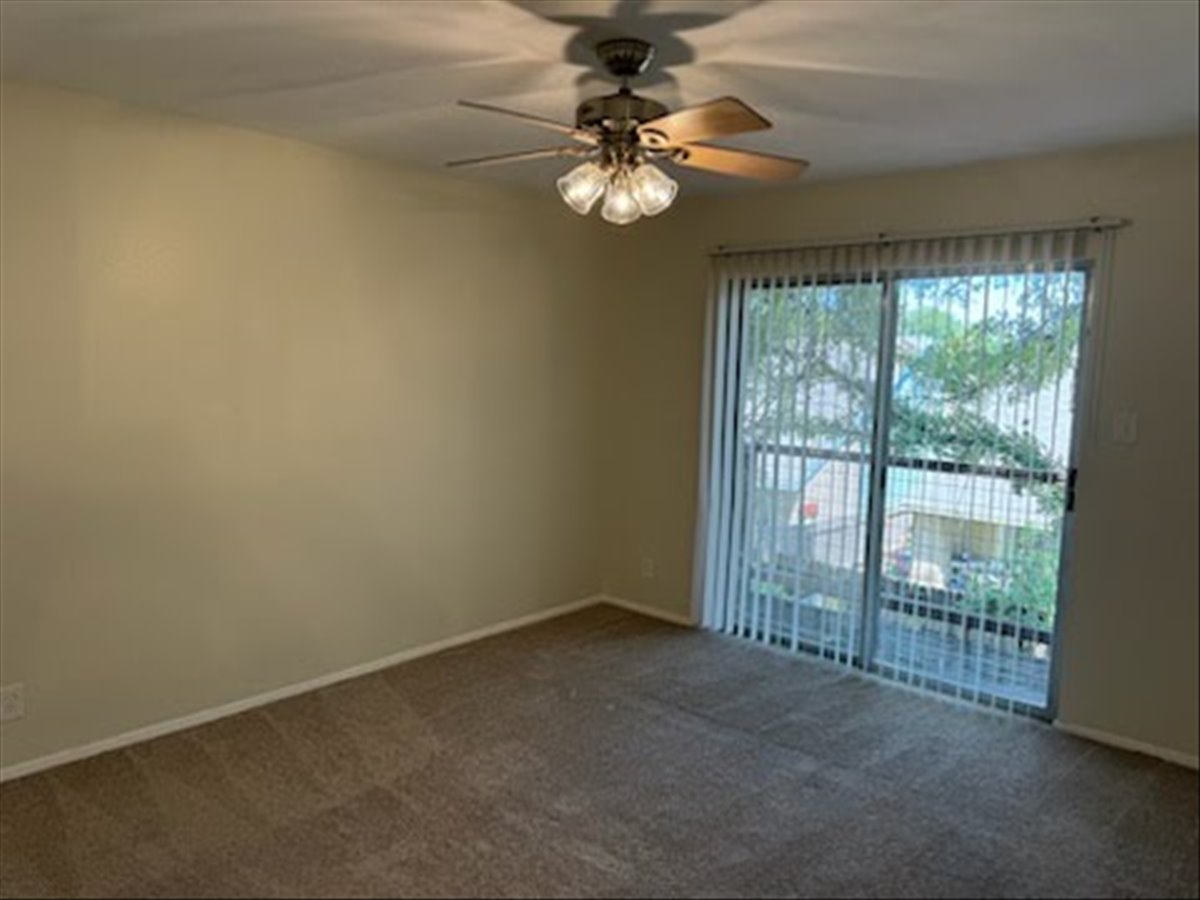 1504 Waterloo Trail, Unit A Austin, TX 78704 - Photo 8 of 12 Spare room with ceiling fan and carpet