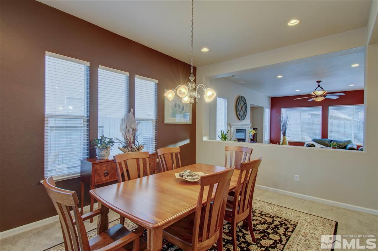 1652 Broadstone Way Reno, NV 89521 - Photo 11 of 25 a dining room with furniture a chandelier and window