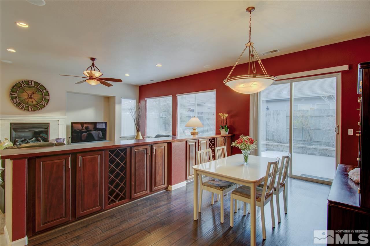 1652 Broadstone Way Reno, NV 89521 - Photo 13 of 25 a view of a dining room with furniture window and wooden floor