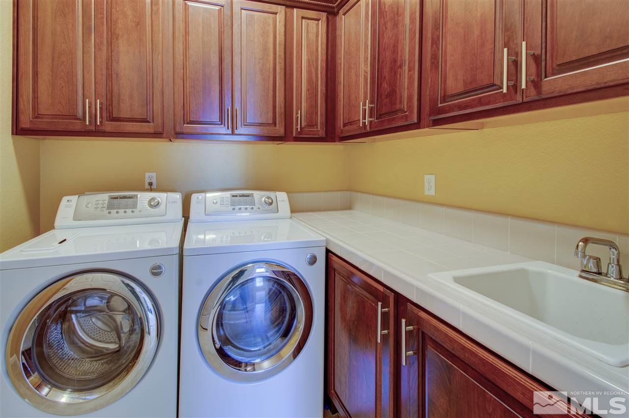 1652 Broadstone Way Reno, NV 89521 - Photo 17 of 25 a utility room with sink dryer and washer