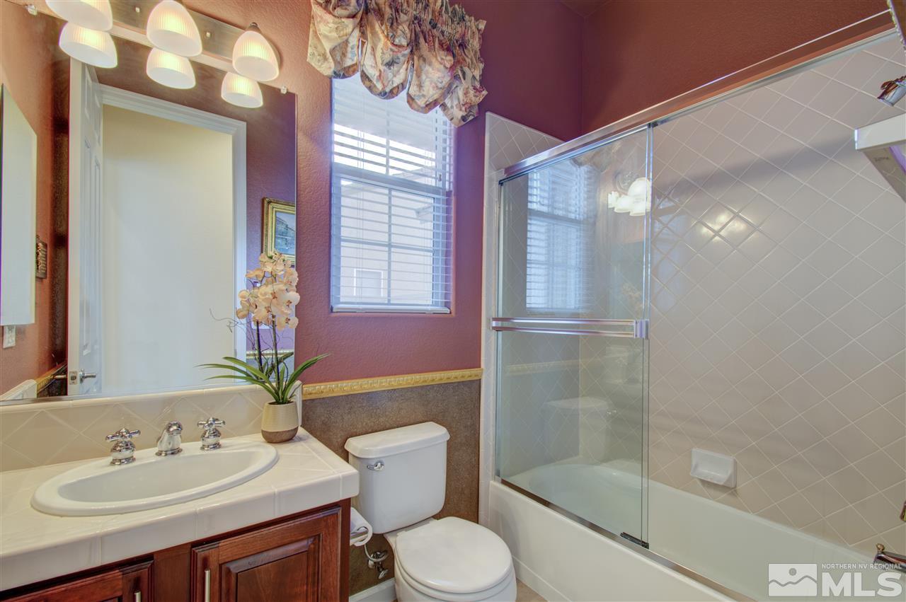 1652 Broadstone Way Reno, NV 89521 - Photo 19 of 25 a bathroom with a sink toilet and shower