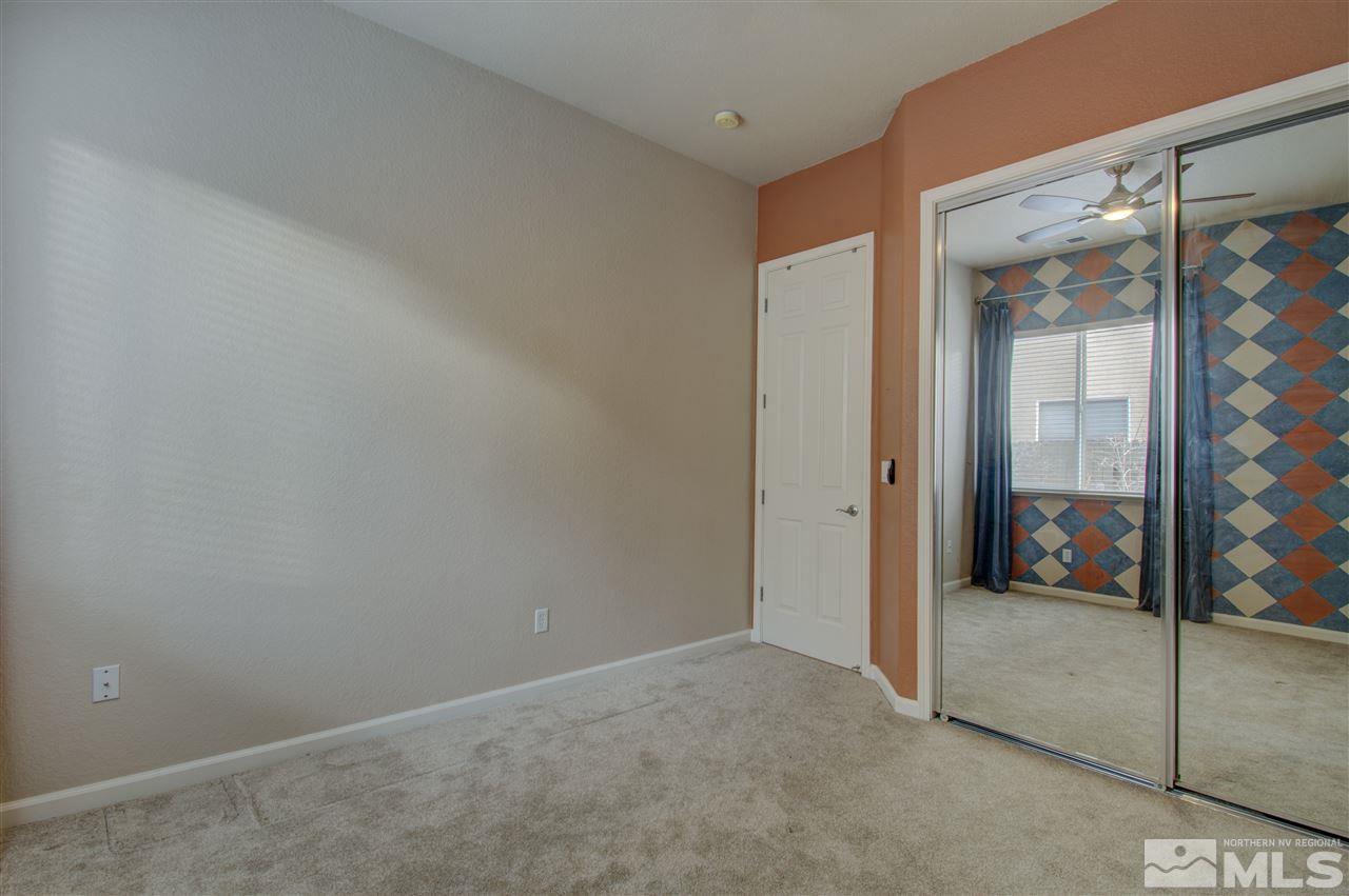 1652 Broadstone Way Reno, NV 89521 - Photo 22 of 25 an empty room with sliding glass door