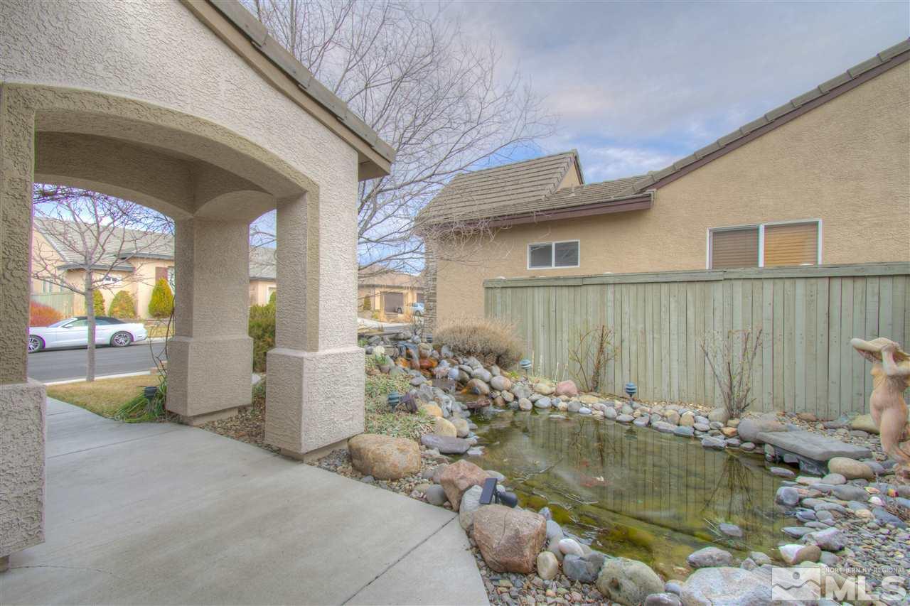 1652 Broadstone Way Reno, NV 89521 - Photo 6 of 25 a view of a house with pool bath tub and chairs