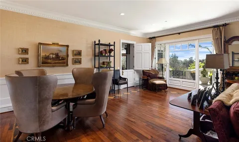 a living room with furniture a rug and a large window