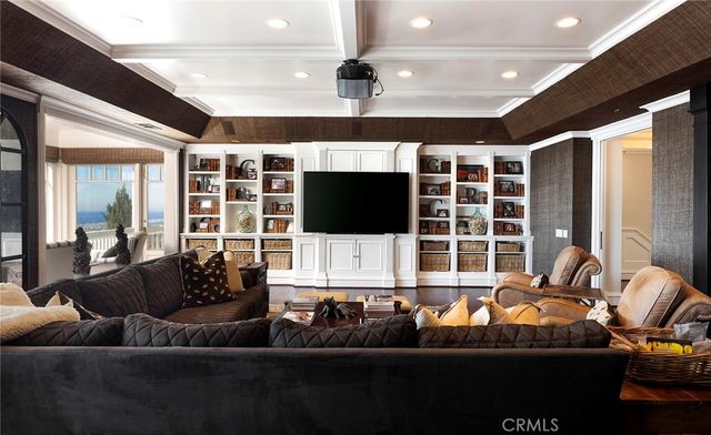 a living room with furniture fireplace and flat screen tv
