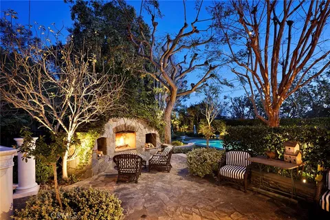 an aerial view of a house with a swimming pool yard and outdoor seating