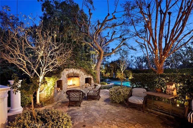 an aerial view of a house with a swimming pool yard and outdoor seating