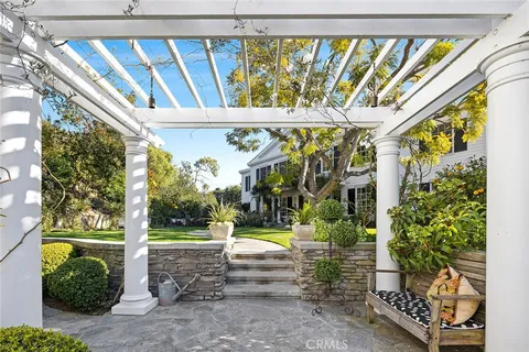 a view of swimming pool with a patio and garden