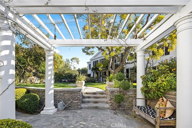 a view of swimming pool with a patio and garden