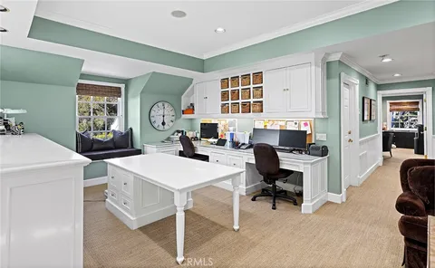 a workspace with furniture and a window