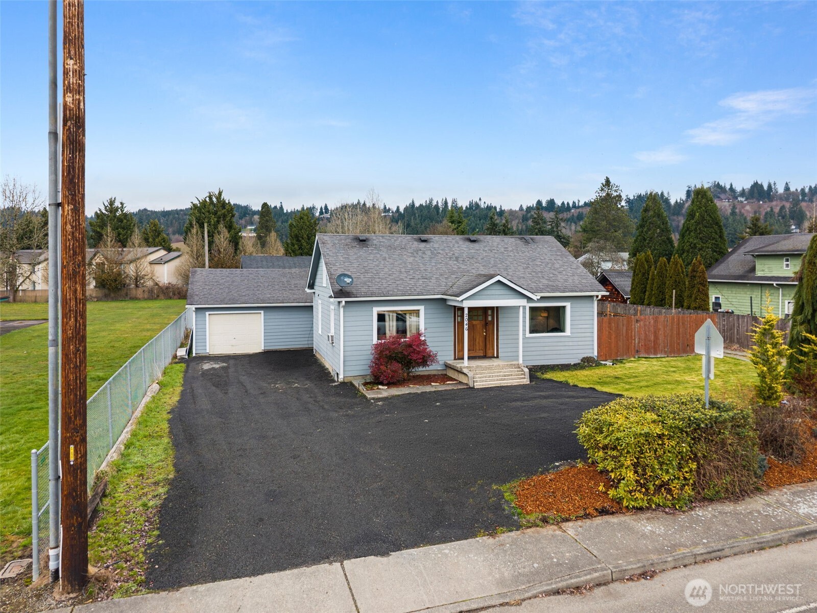 2046 Southwest Salsbury Avenue Chehalis, WA 98532 - Photo 1 of 36 a front view of a house with a yard
