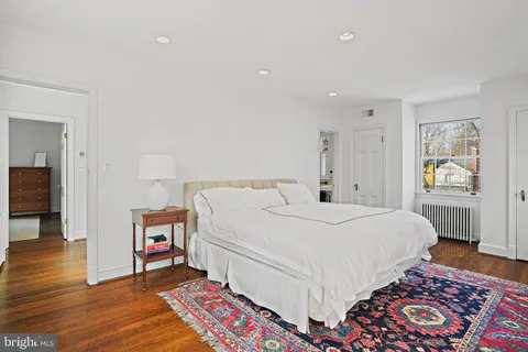 a bed room with a bed and a lamp