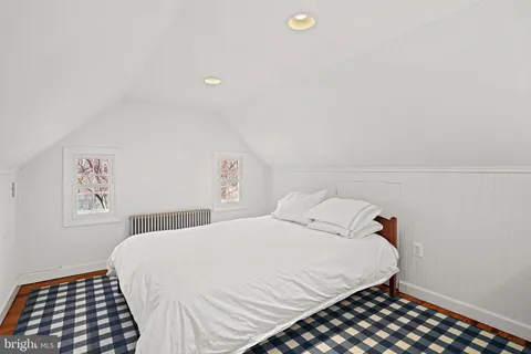 a bedroom with a bed and a cabinets