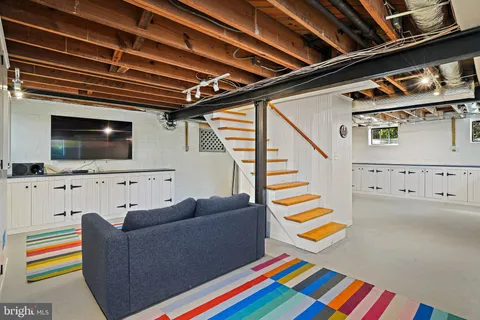 a living room with furniture and flat screen tv