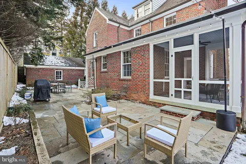 a view of a patio with a table and chairs