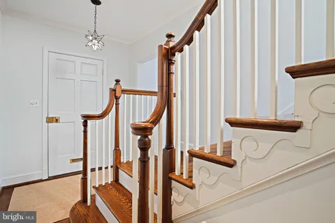 a view of a hallway with staircase