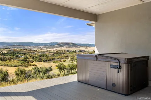 a view of a kitchen with wooden floor and a sink