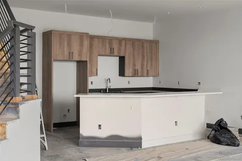 a room with a sink and cabinets