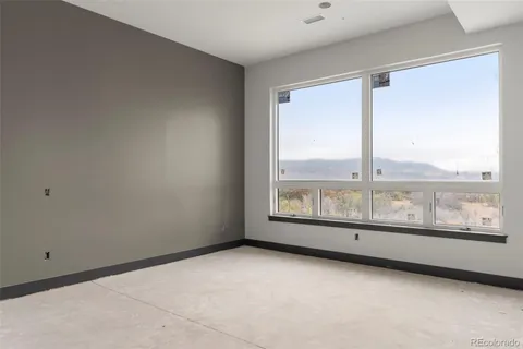 a view of an empty room with a large window