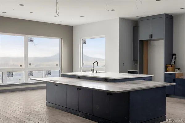 a kitchen with a sink and a stove
