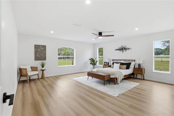 a living room with furniture and windows