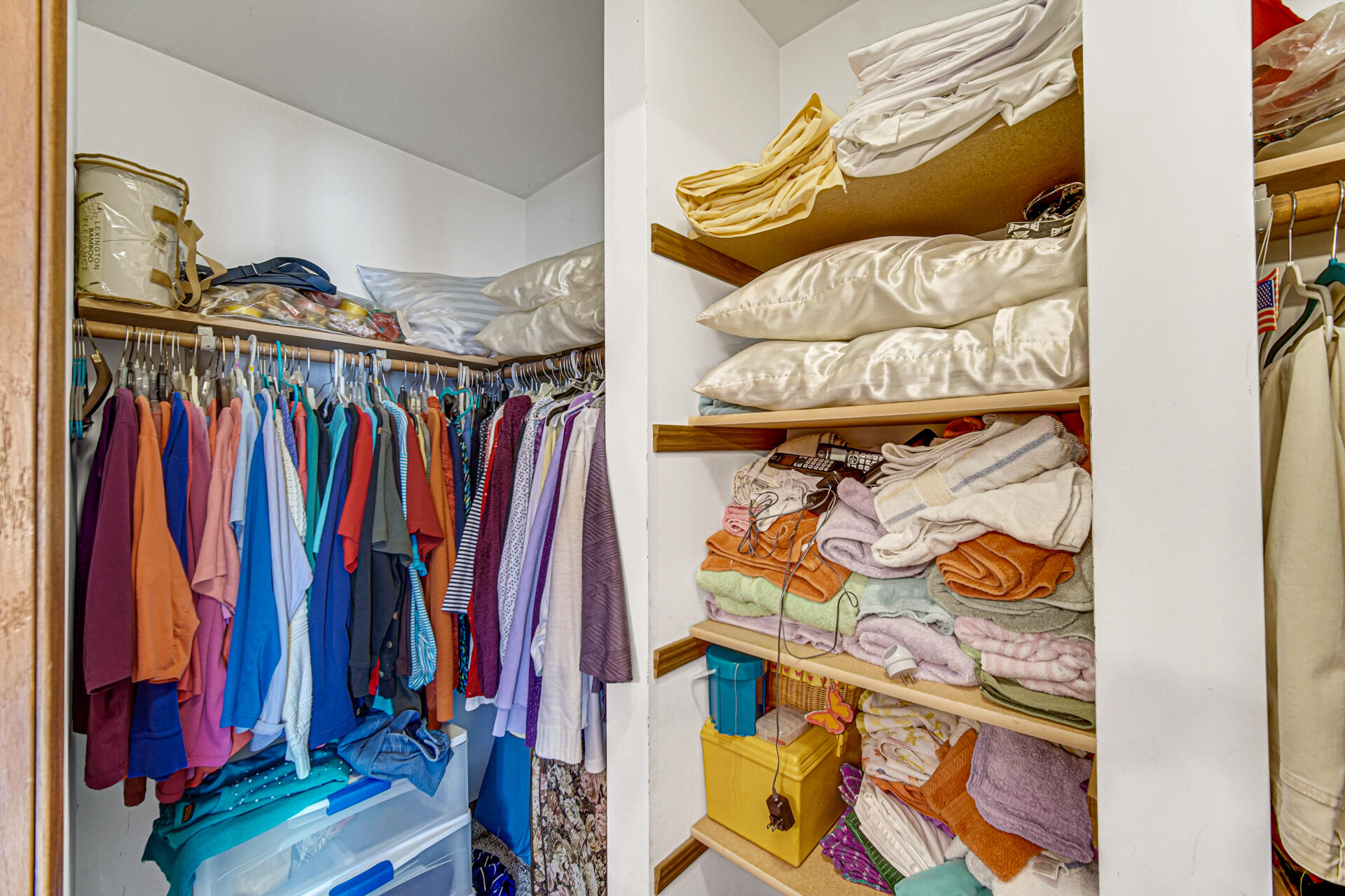 8613 Van Buren Street Merrillville, IN 46410 - Photo 11 of 18 a view of walk in closet with clothes and shoes