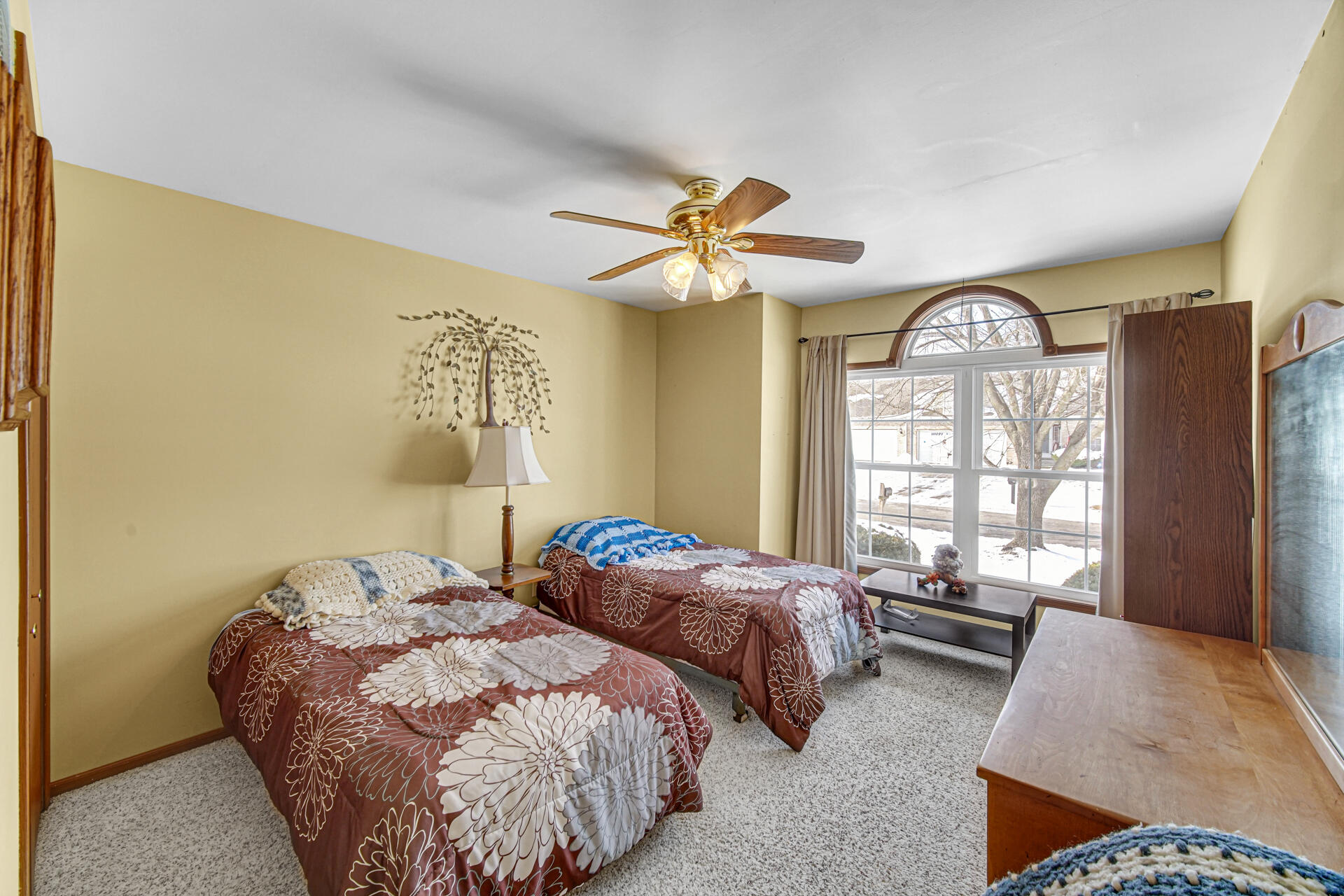 8613 Van Buren Street Merrillville, IN 46410 - Photo 12 of 18 a bedroom with two beds and a large window