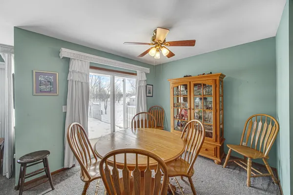 a dining room with furniture and window